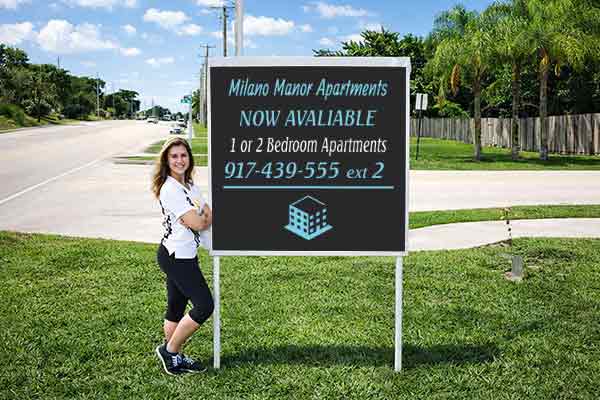 4x4 apartment sign with patented post pockets and metal post kit installed outdoors