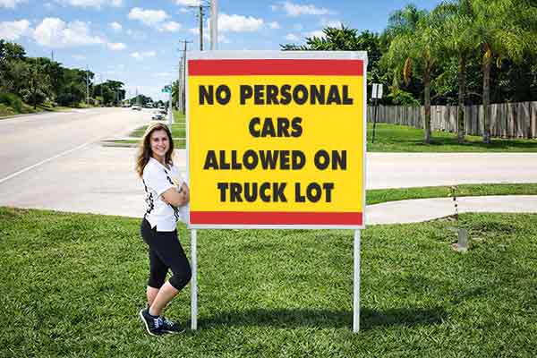 4x4 auction sign with metal post kit installed outdoors