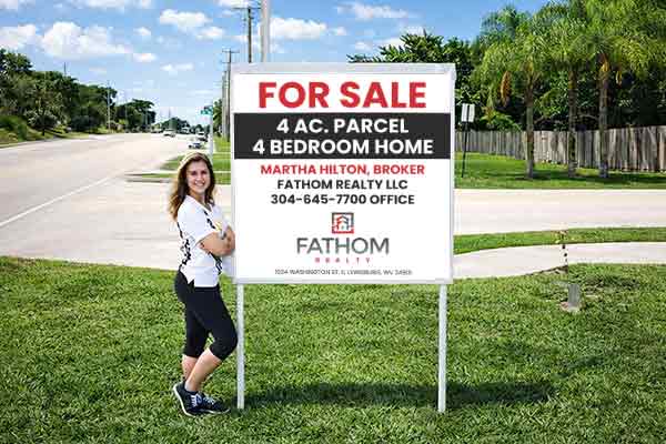 4x4 Fathom Realty sign with metal post kit installed